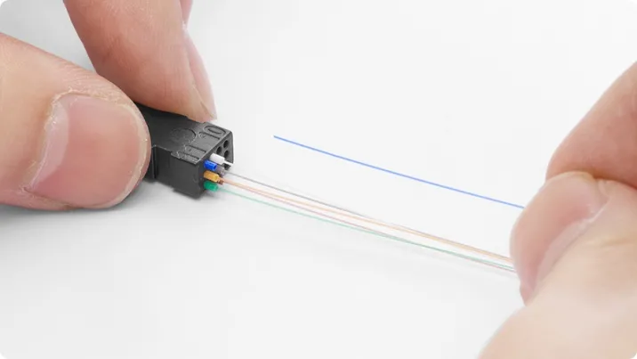 Route the fibers into tight-buffer tubes according to the color